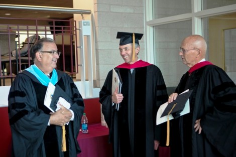 Easton Mayor Sal Panto, l-r, Stephen Pryor ’71, vice chair of the board, and David Reif ’68, president of the Alumni Association, mingle during the robing in Kirby Sports Center.