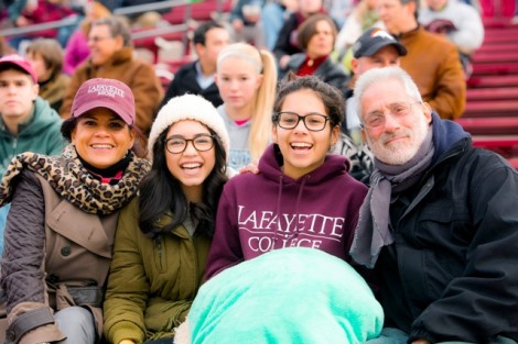 Daisy Nevarez (leftl-right), Natalia Nevarez '17, Mariah Fontanez-Lutsky ’17, and Mark Lutsky enjoy the game.