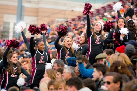 The cheerleaders lead the crowd.