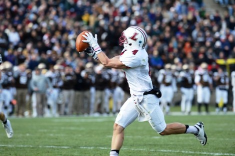 Wide receiver Justin Adams ’15 catches one of his five receptions. 
