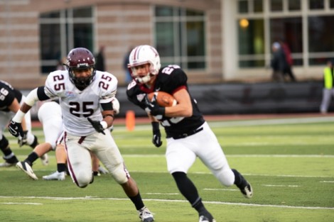 Running back Ross Scheuerman ’15 tries to elude a defender.