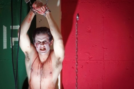Brian Ashnault '15 is restrained in the 'playroom basement of Phi Kappa Psi fraternity house.
