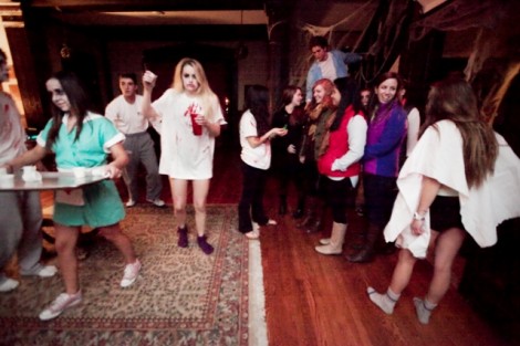 Asylum patients wander around the house. 