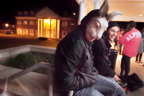 Students enjoy refreshments on the Phi Kappa Psi porch following the haunted house. 