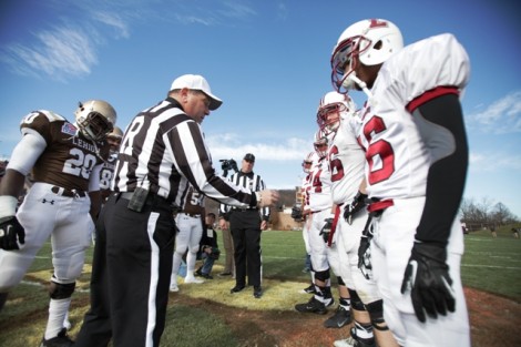 The team captains head out for the coin toss.