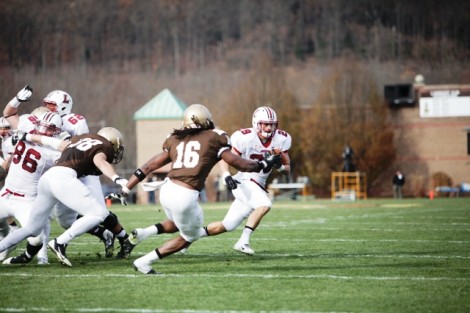 Running back Ross Scheuerman ’15 eludes tacklers.