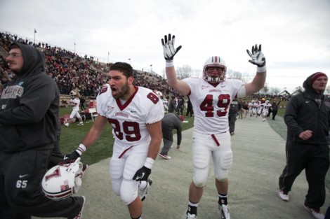 Tight end Zach Schnitzer ’14, left, and fullback Dan Dellovade ’14 cheer for a touchdown. 