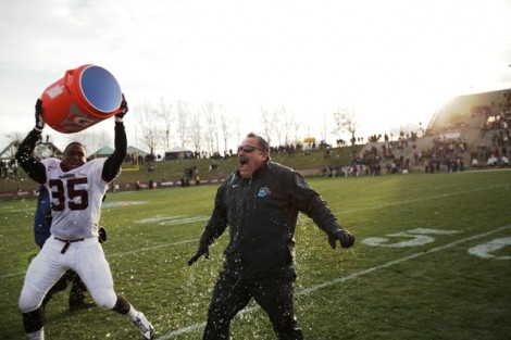 Linebacker Kasheem Hill ’14 gives head coach Frank Tavani a Gatorade shower.