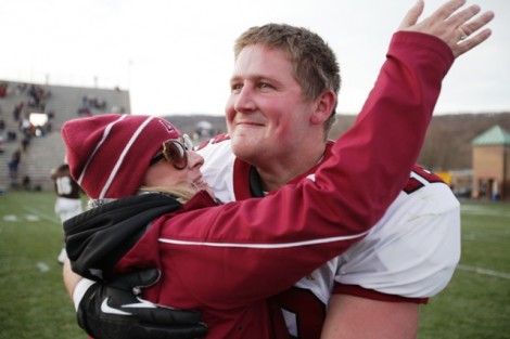 Fullback Pat Creahan ’14 gets a hug from his mom. 