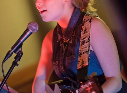 Hannah Weaver '17 plays the guitar and sings a song.