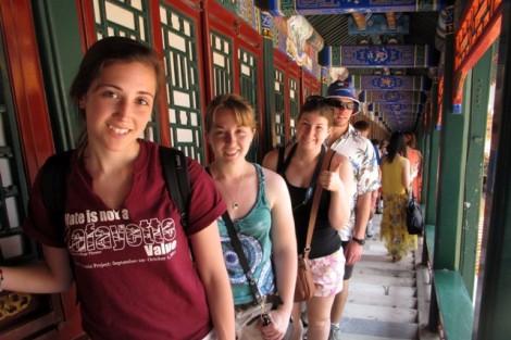 Students pose in a traditional corridor in the Summer Palace in Beijing, China.