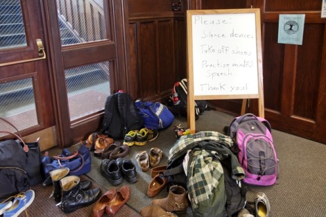 Guests removed their shoes prior to the panel discussion on mind and meditation by Tim Silvestri, assistant director of the counseling center, and monk Geshe Jampa.