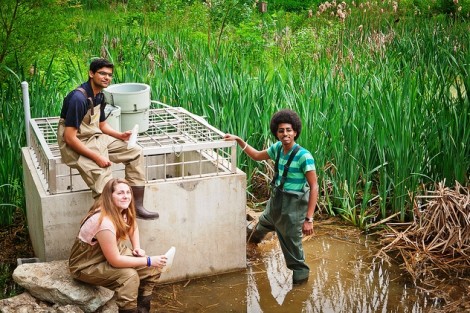 Hassaan Khan ’13, Hannah Griesbach ’13, and Leikune Aragaw ’15 collected water samples and computer data at Sullivan Park to evaluate back in the engineering lab. Professor David Brandes’ students regularly monitor and maintain the site.