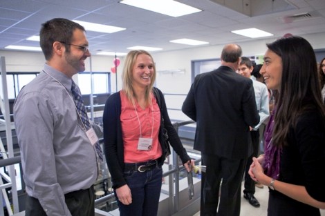 Professor Michael Senra and Christie Pelton ’09 speak with symposium organizer Christina Cucinotta ’14.