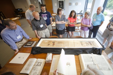 Diane Shaw (center), College archivist, displays unusual and unexpected items from the Special Collections and College Archives of Skillman Library.