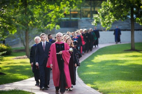 Guy Hovis, John H. Markle Professor of Geology and Environmental Geosciences, leads the academic procession as Bearer of the Mace.