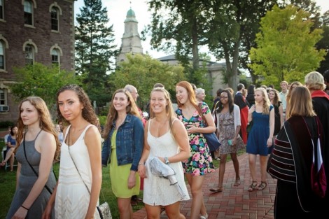 Students are greeted by members of the faculty.