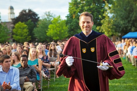 In an annual College tradition, Paul McLoughlin, dean of students, presents the sword of the Marquis de Lafayette to members of the newest class.