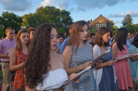 Students sing the Alma Mater.