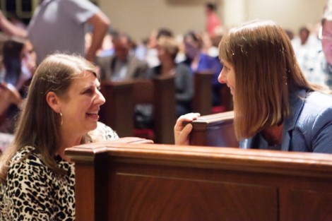 President Alison Byerly speaks with a parent.