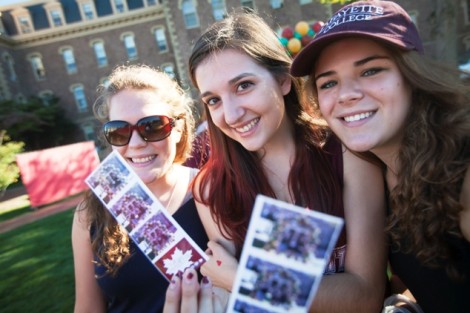Students show off their family photos.