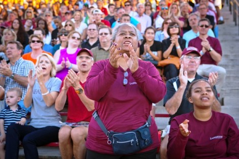 Students and their families cheer on the Leopards.