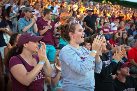Students and their families cheer on the Leopards.