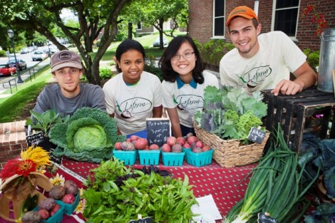 Joseph Ingrao '16, Prisca Ratsimbazafy '17, Hong Ha Vu '17, and Eric Giovannetti '15 sell vegetables at LaFarm’s Summer Market outside Gilbert’s Café.