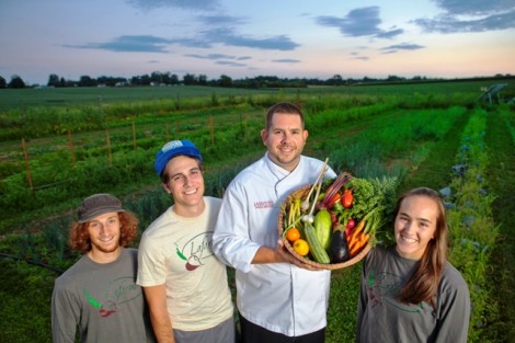 Joseph Ingrao 16, Kevin Jackson '16, John Soder, executive chef of dining services, and Kelly Carpency '16 hold some of the LaFarm produce that will be used in the dining halls.