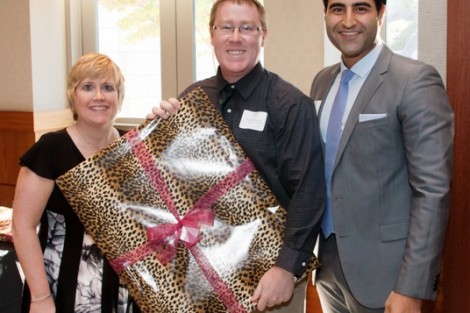 Michael De Lisi ’03 receives the Mayfield Award from Rachel Nelson Moeller ’88, executive director of alumni relations, and Alex Karapetian ’04, president of the Alumni Association.