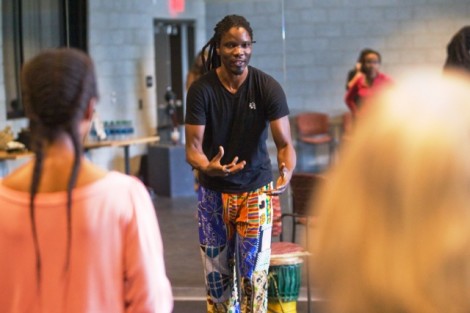Senegalese percussionist Lamine Touré leads the workshop.