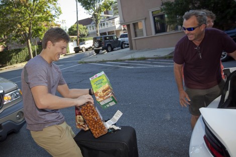 A father and son play catch with various breakfast items.