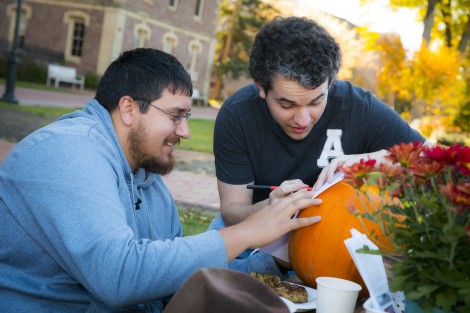 Brandon McKim '16 and Christian Enos '15 use a stencil.