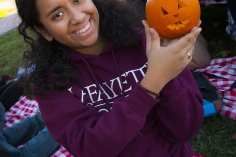 Patrice Gonzalez ’19 presents her tiny pumpkin.
