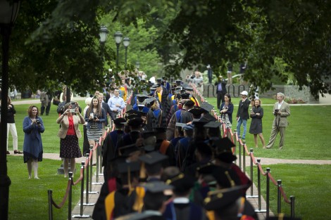 Students make their way through the Quad during the procession.