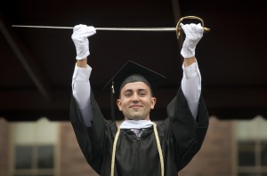 Guilherme Ferreira de Avila ’16 holds the sword of the Marquis de Lafayette.