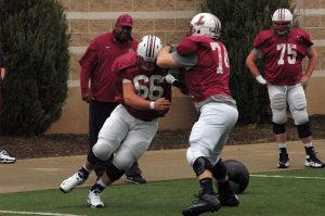 Mike Donnelly '17, number 66, on the field during practice