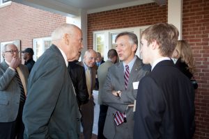Students and alumni mingle at the house dedication ceremony. 
