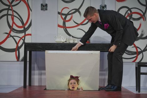 Two students act on stage in a scene from the Lafayette production of the play Tartuffe.