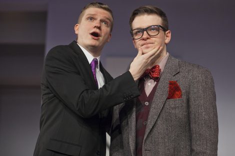 Two students act on stage in a scene from the Lafayette production of the play Tartuffe.