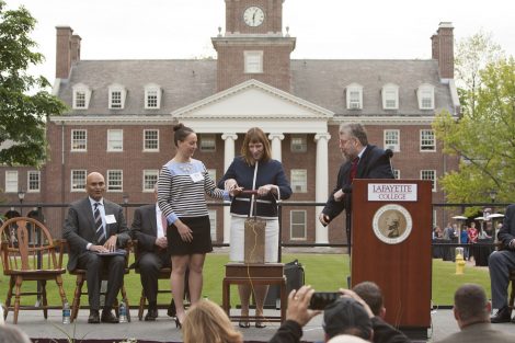 Lafayette President Alison Byerly, Wayne Leibel, Kreider Professor Emeritus of Biology, and Taylor Corsi ’18 get ready to push down on the plunger symbolizing the underground explosion that will break ground for the Integrated Sciences Center.