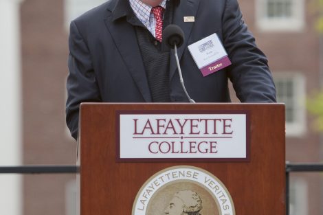 Kent Rockwell '66 smiles at the podium.