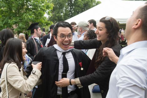 Friends celebrate after the Commencement ceremony.