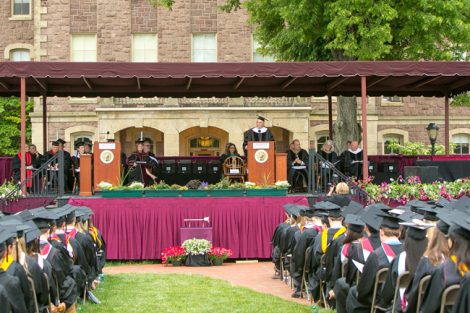 The graduates listen to Ron Chernow.