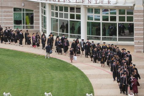 Students begin the walk to Commencement from Kirby Sports Center.