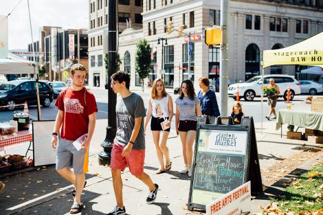 Students walk downtown.