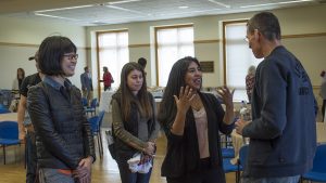 Chip Bergh '79 talks with three students after his presentation.