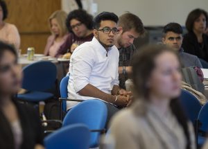 A student listens to Chip Bergh.