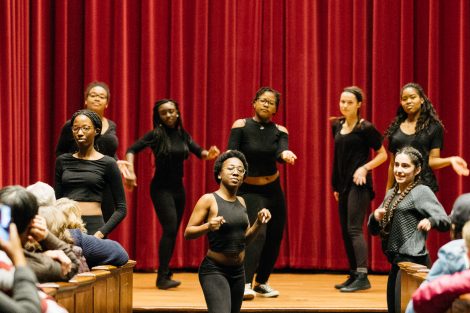 Student dancers perform on stage.