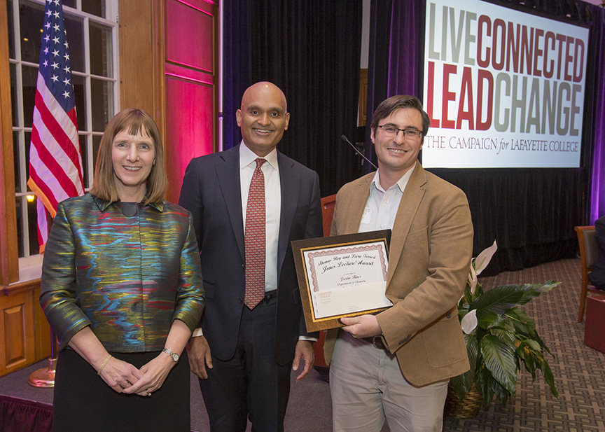 Lafayette President Alison Byerly, Provost Abu Rizvi, and Justin Hines, who is holding his Jones Lecture Award
